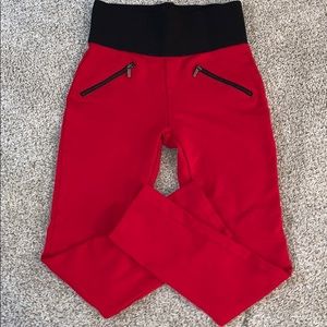 Red leggings, black elastic waistband